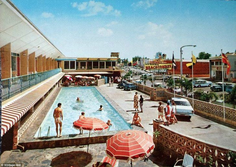 A Gold Coast motor lodge pool with red striped umbrellas